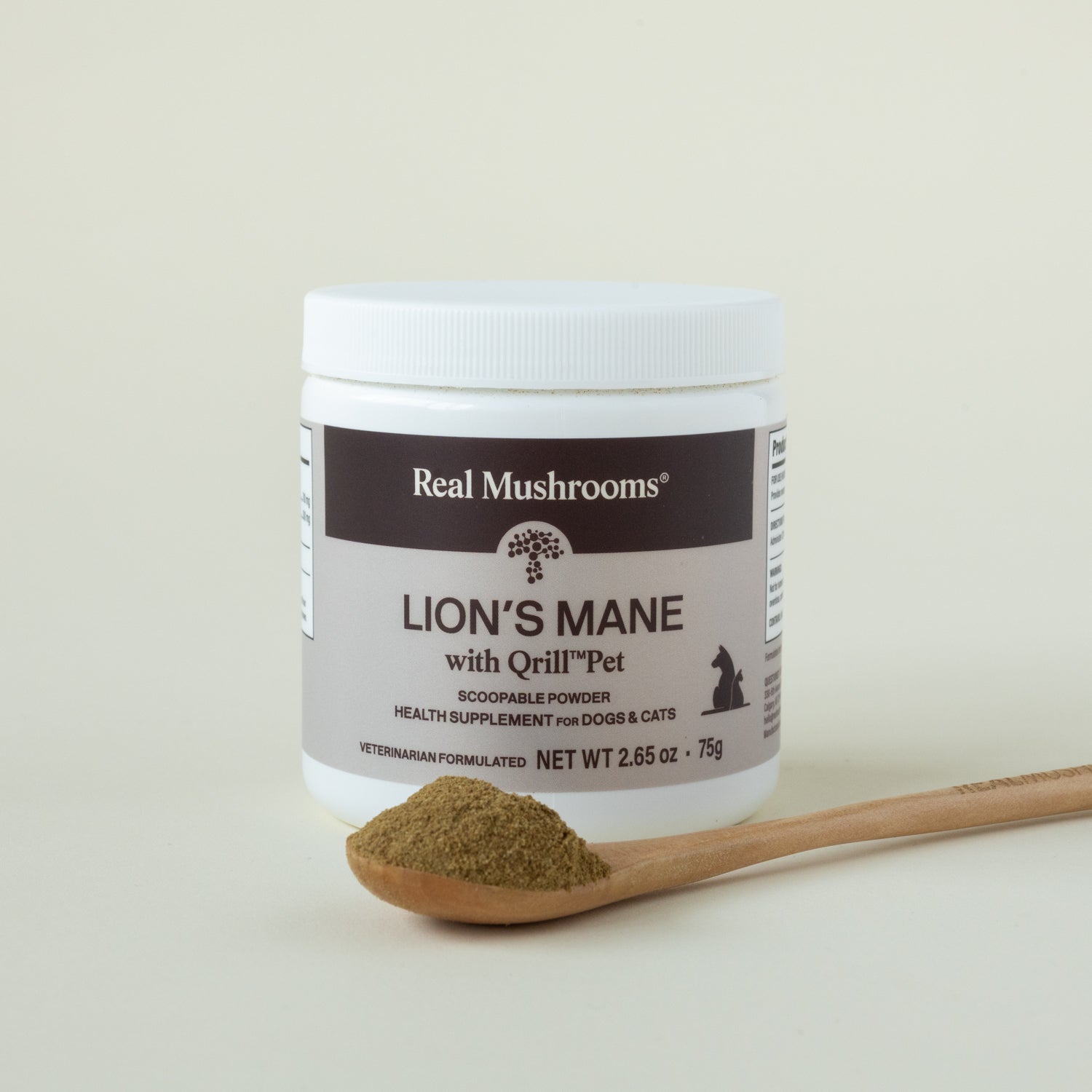 A container of Real Mushrooms Lion's Mane with Qrill™Pet supplement powder sits beside a wooden spoon holding brown powder, providing cognitive support for pets.