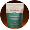 A pouch labeled "Real Mushrooms 5 Defenders Mushroom Extract Powder" stands against a brown background.