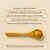 A wooden spoon with yellow Cordyceps powder sits on a beige surface, featuring text about Real Mushrooms Organic Cordyceps Extract Capsules’ stamina and energy support benefits, plus a disclaimer below.