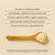 A wooden spoon with Functional Coconut Creamer - Powder by Real Mushrooms sits on a beige surface, alongside text showcasing its organic ingredients and immune support benefits.