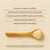 A wooden spoon with mushroom powder, rich in golden oyster mushrooms, rests on a beige surface beside text showcasing Real Mushrooms' Ergo+ Ergothioneine Supplement and its organic ingredients and health benefits.