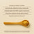A wooden spoon with yellow Cordyceps mushroom powder on a beige background, beside text showcasing Real Mushrooms’ RealBoost—Cordyceps, Guayusa, and Ginseng—for natural ingredients and health benefits in an organic supplement.