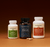 The Real Mushrooms Focus Power Trio is displayed against a brown background with two capsules in front, showcasing natural support for brain health and mental performance.