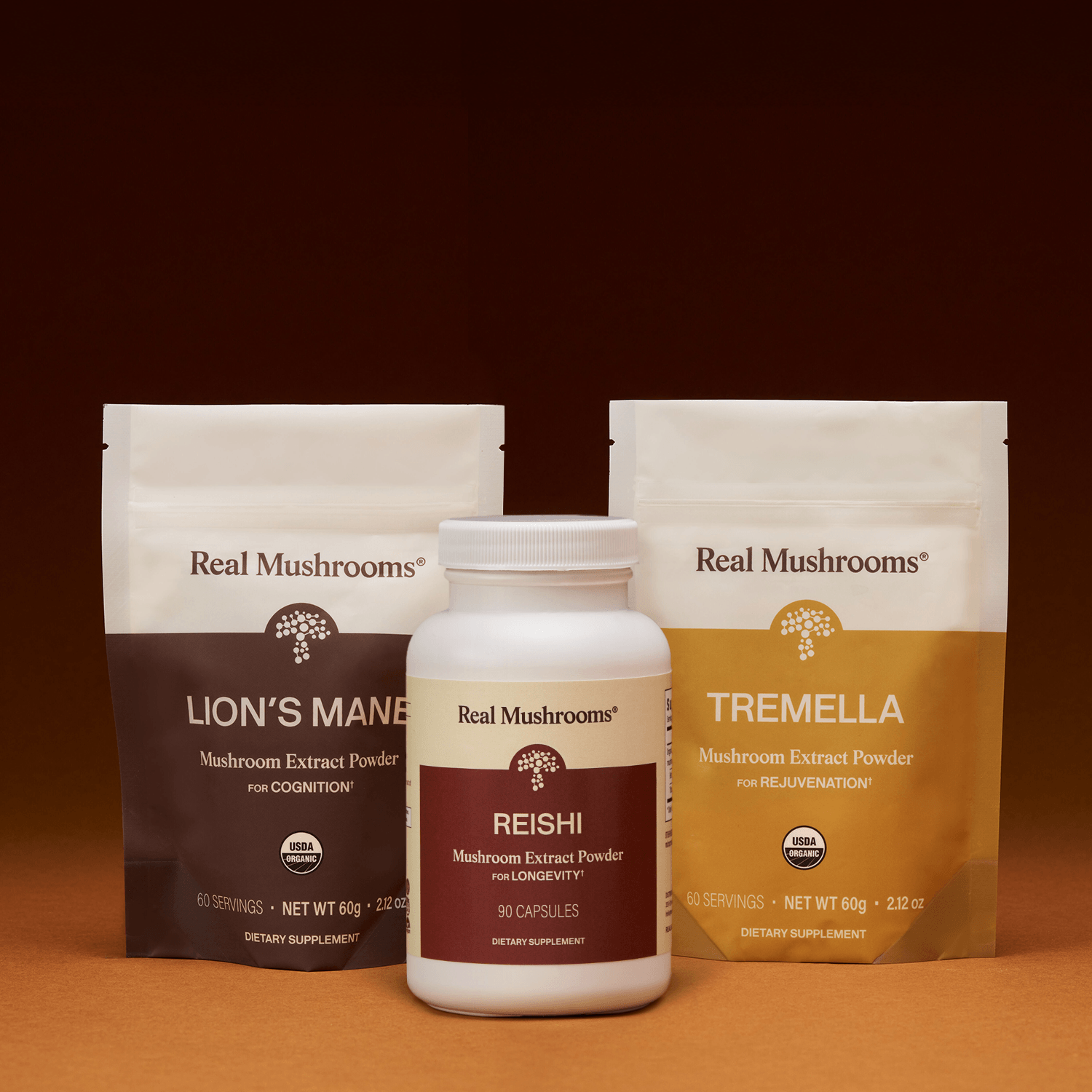 The Real Mushrooms Longevity Pack is displayed upright against a brown background, featuring premium mushroom extracts renowned for supporting brain health.
