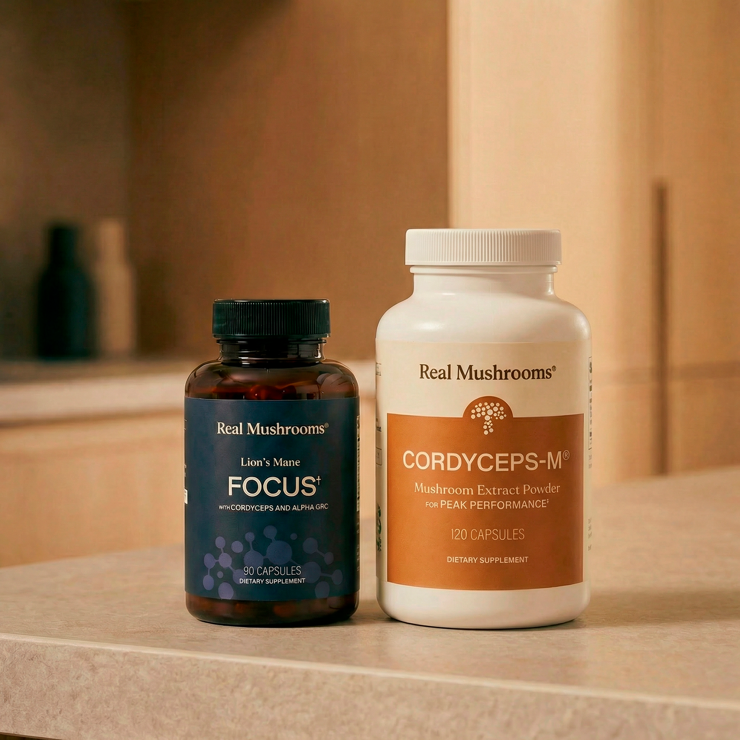 The Focus Power Duo from Real Mushrooms, designed to support mental performance, is displayed on a kitchen countertop.