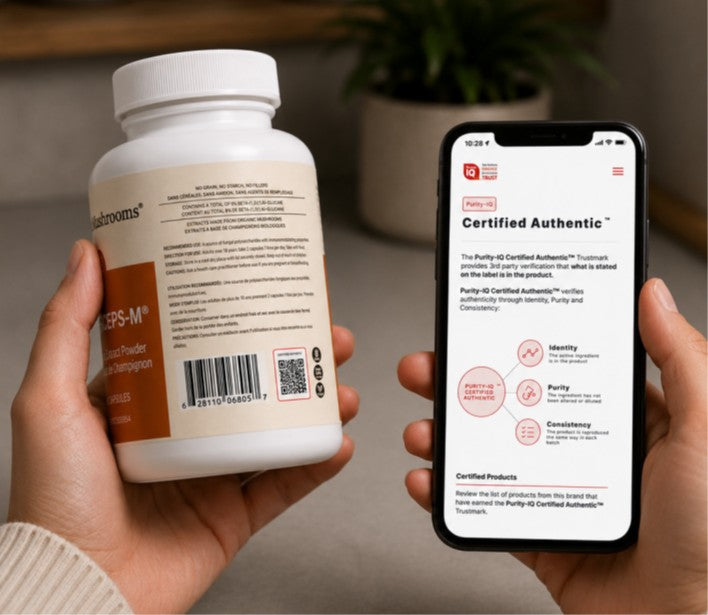 A person holds a supplement bottle in one hand and a smartphone displaying a “Certified Authentic” verification page in the other hand.