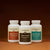 Three bottles of Real Mushrooms’ The Big 3 supplements are arranged side by side on a plain surface with a neutral background, highlighting their mushroom extracts for brain health and immune support.