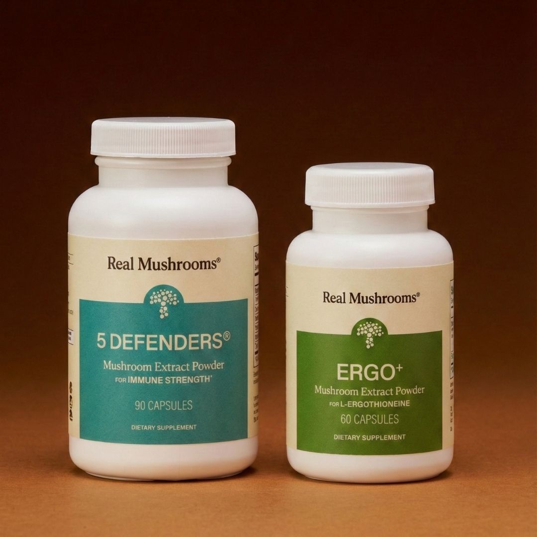 Two bottles of Real Mushrooms Immune Power supplements are placed side by side against a brown background, emphasizing powerful mushroom-based immune support.
