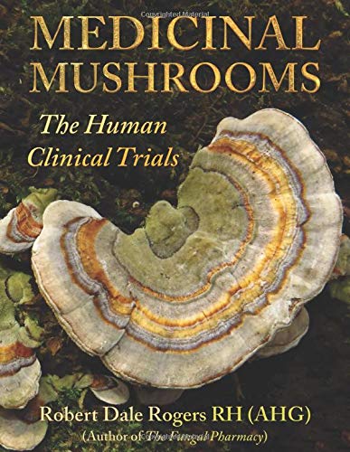 The cover of "Medicinal Mushrooms: The Human Clinical Trials" by Robert Dale Rogers showcases an array of mushrooms, prominently featuring a bracket fungus, making it a striking addition to any medicinal mushroom book collection.