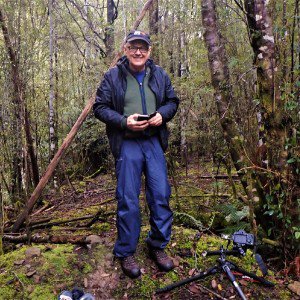 Bronek Burza standing in a forest 