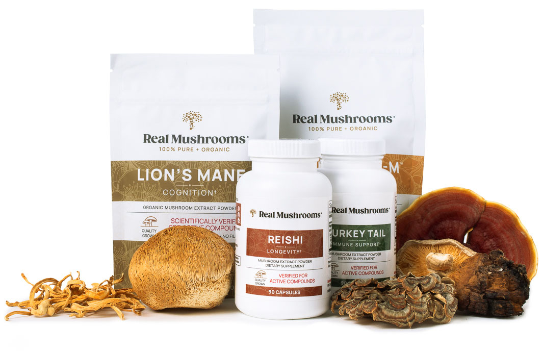 A variety of Real Mushrooms products, including Lion's Mane and Turkey Tail powders, Reishi capsules, and dried mushrooms, are displayed against a white background.