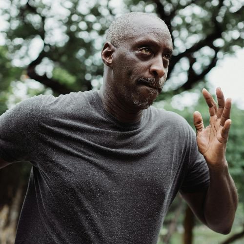 Adult man running looking focused