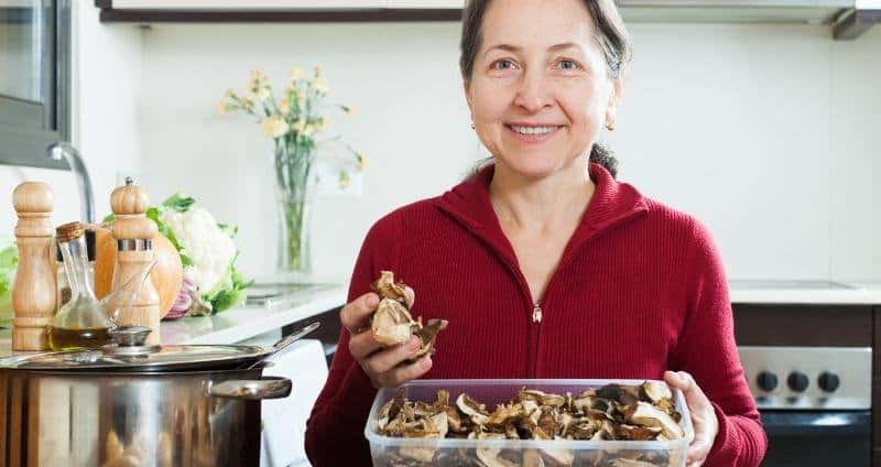 image of woman holding mushrooms